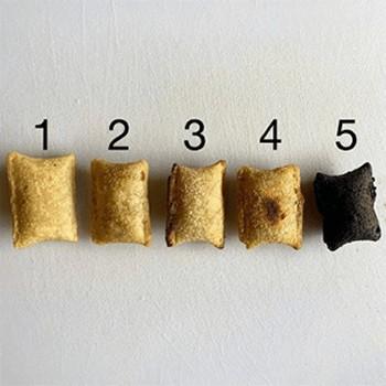 A row of Pizza Rolls in varying shades from light brown to charcoal, above them is a rating scale from 1-5 in correlation to how burnt they are. - Link to social post